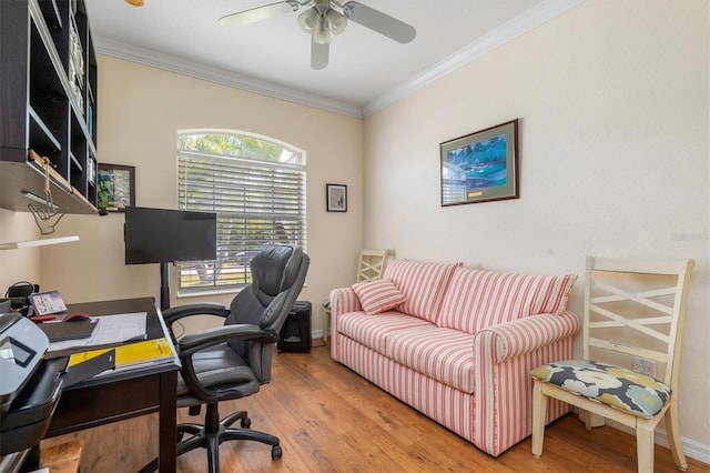 office area with ornamental molding, wood finished floors, a ceiling fan, and baseboards