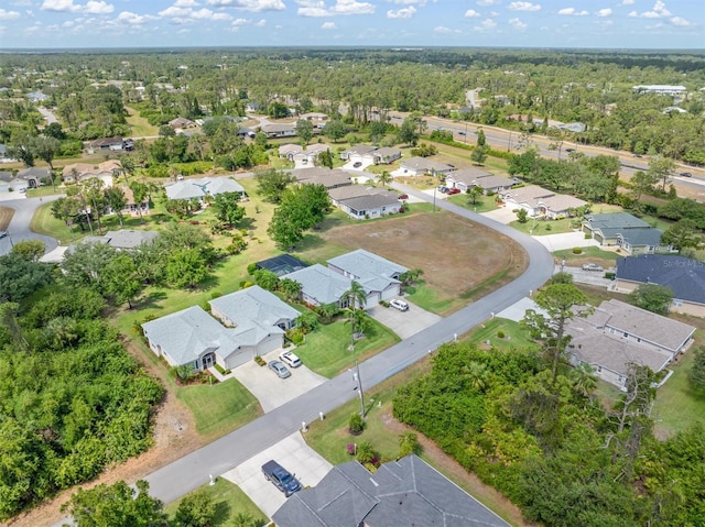 aerial view of property's location featuring nearby suburban area