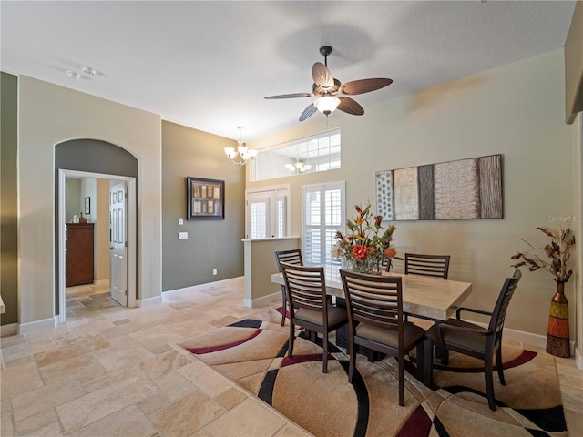 11982 Granite Woods Loop, Venice, FL 34292 - dining space with ceiling fan, a chandelier, stone tile floors, and baseboards