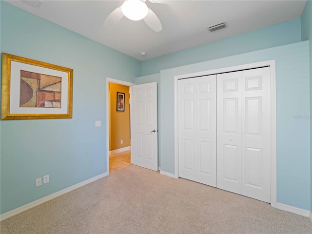 11982 Granite Woods Loop, Venice, FL 34292 - unfurnished bedroom with carpet floors, baseboards, a closet, and ceiling fan