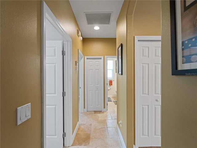 11982 Granite Woods Loop, Venice, FL 34292 - hall with stone tile floors and baseboards