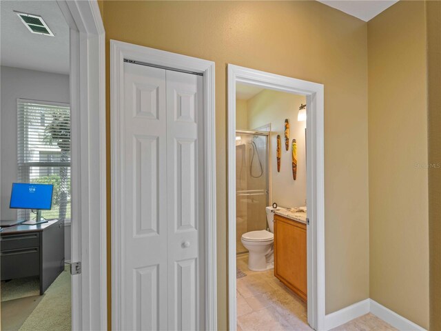 11982 Granite Woods Loop, Venice, FL 34292 - full bath featuring a closet, a stall shower, toilet, and vanity