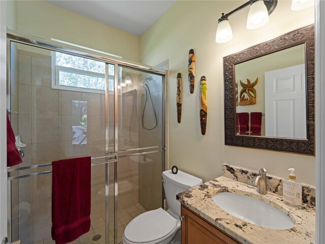 11982 Granite Woods Loop, Venice, FL 34292 - full bath with vanity, toilet, and a stall shower