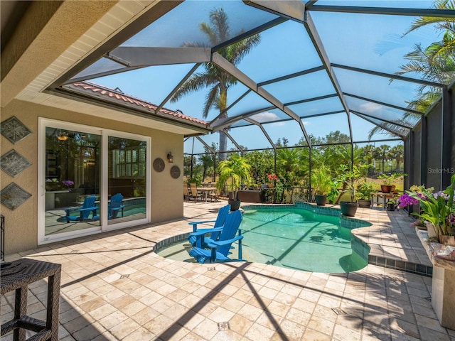 11982 Granite Woods Loop, Venice, FL 34292 - outdoor pool with a patio area and glass enclosure