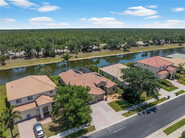 11982 Granite Woods Loop, Venice, FL 34292 - aerial view of residential area with a heavily wooded area and a large body of water