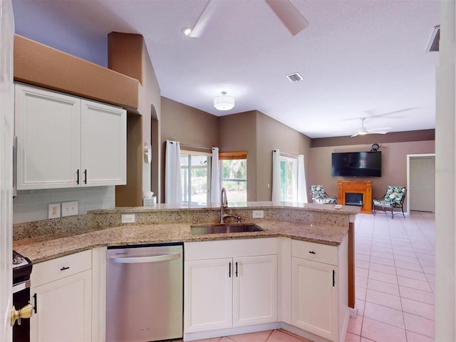 4027 Quaker Ln, North Port, FL 34288 - kitchen with a sink, appliances with stainless steel finishes, ceiling fan, a peninsula, and white cabinets