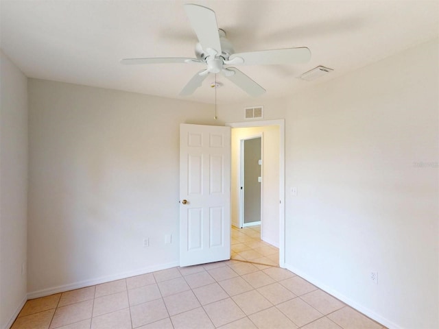 4027 Quaker Ln, North Port, FL 34288 - unfurnished room featuring a ceiling fan, light tile patterned flooring, and baseboards