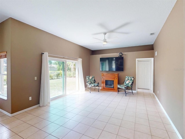 4027 Quaker Ln, North Port, FL 34288 - living area with ceiling fan, baseboards, and light tile patterned flooring