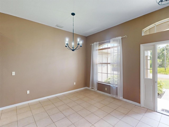 4027 Quaker Ln, North Port, FL 34288 - unfurnished room featuring a chandelier, baseboards, and light tile patterned floors
