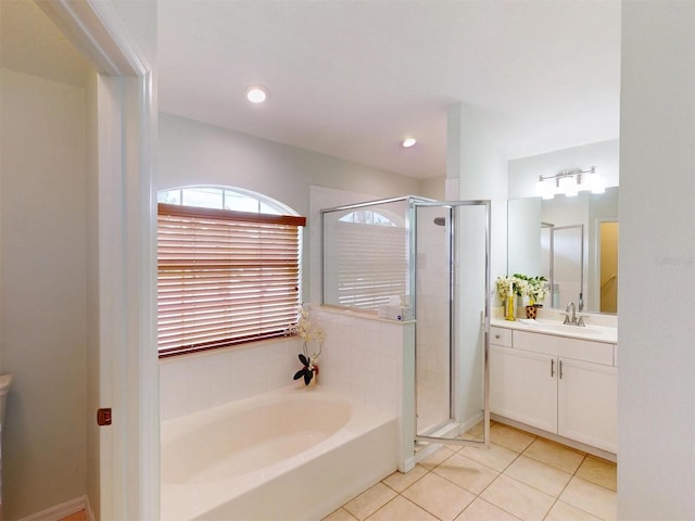 4027 Quaker Ln, North Port, FL 34288 - full bathroom with a stall shower, tile patterned flooring, a garden tub, vanity, and recessed lighting