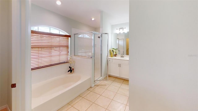 4027 Quaker Ln, North Port, FL 34288 - full bathroom with a shower stall, tile patterned floors, a bath, and vanity