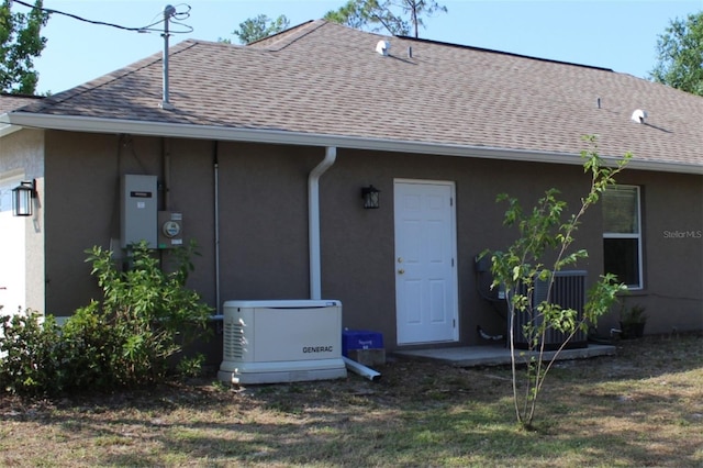 4027 Quaker Ln, North Port, FL 34288 - back of house with roof with shingles and stucco siding