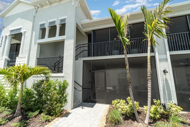 43984 Boardwalk Loop Unit 1726, Punta Gorda, FL 33982 - rear view of property featuring stucco siding