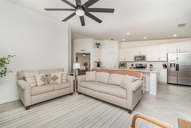43984 Boardwalk Loop Unit 1726, Punta Gorda, FL 33982 - living room featuring a ceiling fan, recessed lighting, light tile patterned floors, and vaulted ceiling