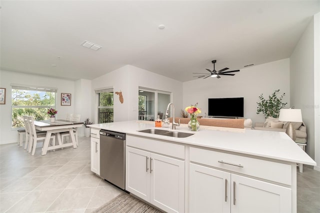 43984 Boardwalk Loop Unit 1726, Punta Gorda, FL 33982 - kitchen featuring dishwasher, a sink, open floor plan, white cabinets, and light countertops