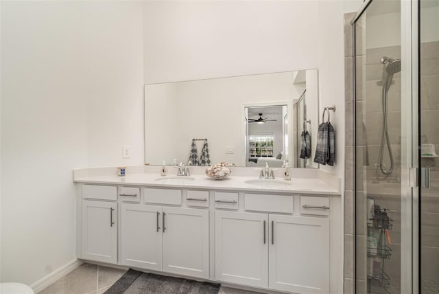 43984 Boardwalk Loop Unit 1726, Punta Gorda, FL 33982 - ensuite bathroom featuring a stall shower, double vanity, baseboards, and a ceiling fan