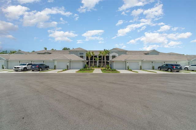 43984 Boardwalk Loop Unit 1726, Punta Gorda, FL 33982 - multi unit property featuring community garages, a residential view, and stucco siding