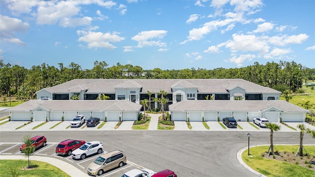 43984 Boardwalk Loop Unit 1726, Punta Gorda, FL 33982 - view of property with community garages and uncovered parking