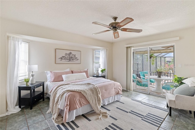 3301 Santa Barbara Dr, Punta Gorda, FL 33983 - bedroom with access to exterior, multiple windows, a textured ceiling, tile patterned floors, and ceiling fan