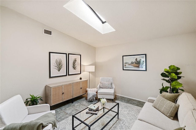 3301 Santa Barbara Dr, Punta Gorda, FL 33983 - living area with a skylight, vaulted ceiling, and baseboards