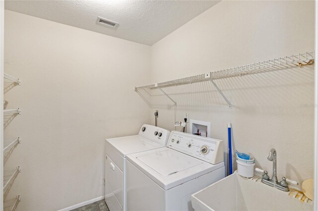 3301 Santa Barbara Dr, Punta Gorda, FL 33983 - laundry room with washer and dryer and baseboards