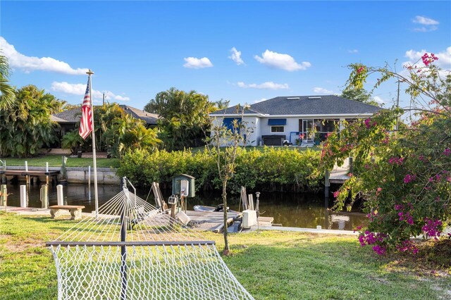 3301 Santa Barbara Dr, Punta Gorda, FL 33983 - dock with a water view and a yard