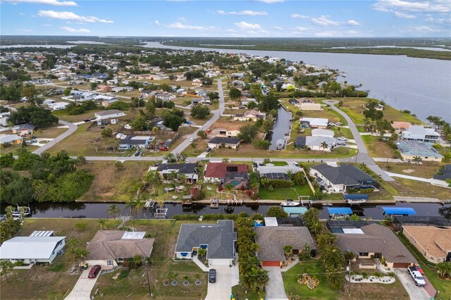 3301 Santa Barbara Dr, Punta Gorda, FL 33983 - aerial view of property and surrounding area with a large body of water and nearby suburban area