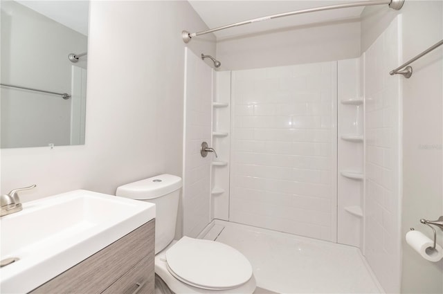 full bathroom with toilet, vanity, and a shower