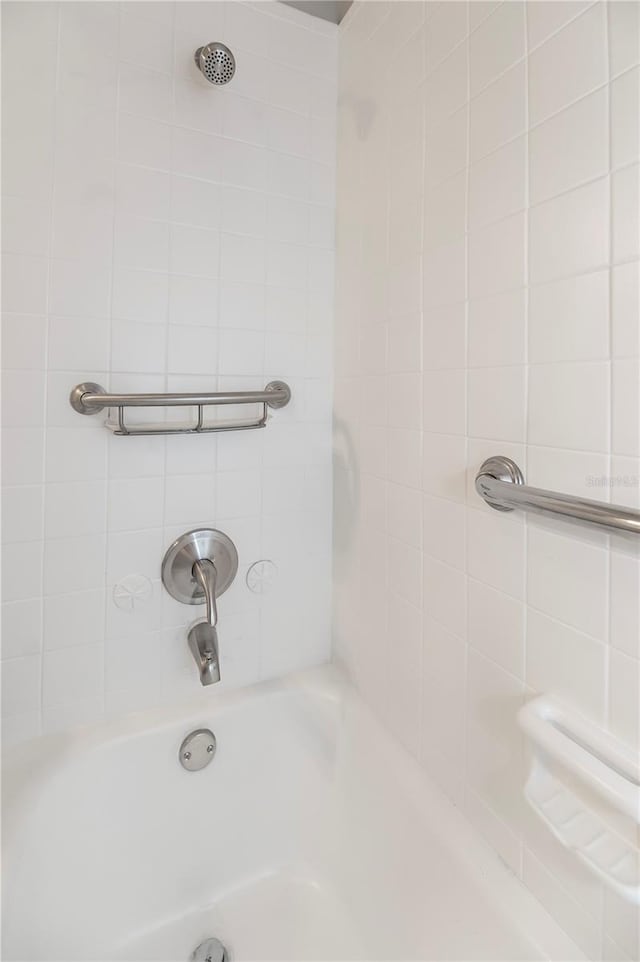 bathroom featuring a shower and a bath