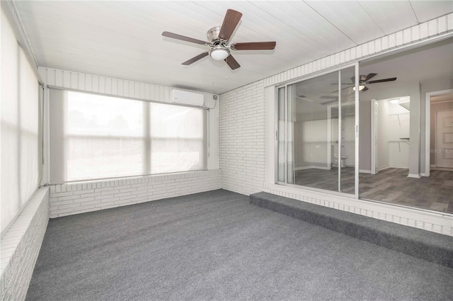 unfurnished sunroom featuring ceiling fan and an AC wall unit