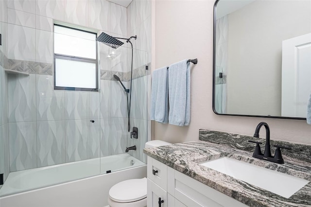 bathroom with toilet, bath / shower combo with glass door, and vanity