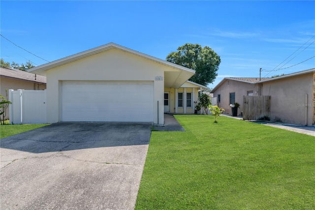 ranch-style house featuring a garage, driveway, and stucco siding