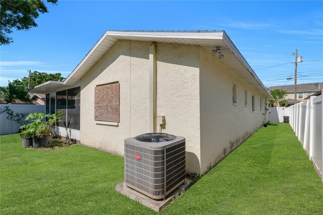 view of home's exterior featuring stucco siding and cooling unit