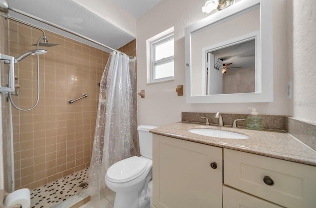 full bath featuring vanity, toilet, and a shower stall