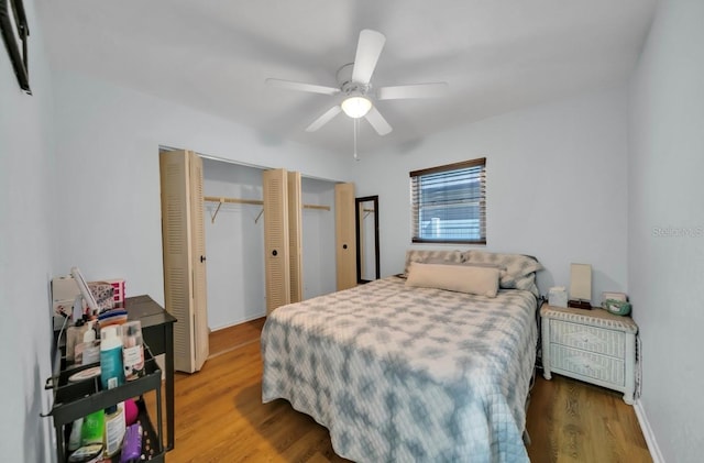 bedroom with wood finished floors, a closet, and a ceiling fan