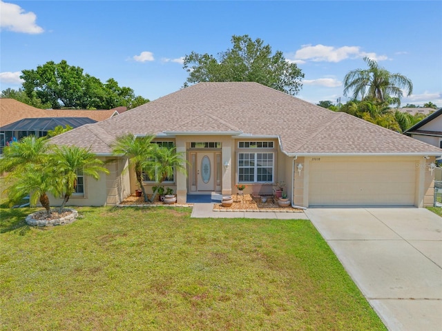 27038 San Jorge Dr, Punta Gorda, FL 33983 - ranch-style home with a garage, driveway, a front lawn, a shingled roof, and stucco siding