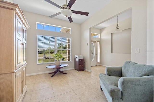 27038 San Jorge Dr, Punta Gorda, FL 33983 - sitting room featuring healthy amount of natural light, light tile patterned floors, a ceiling fan, and baseboards