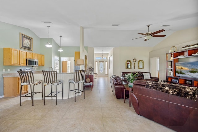 27038 San Jorge Dr, Punta Gorda, FL 33983 - living area featuring lofted ceiling, ceiling fan, and light tile patterned floors