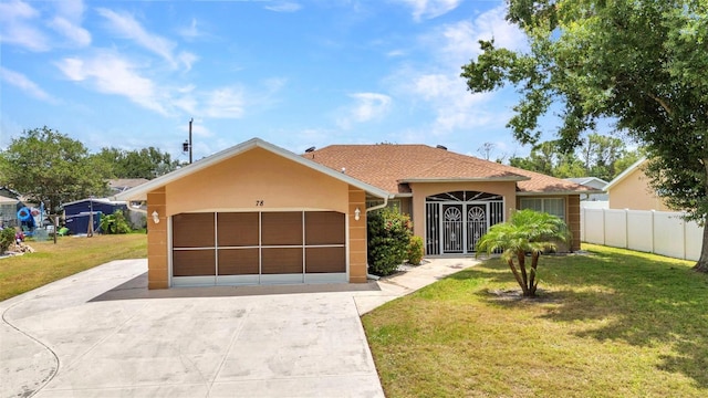 view of front of house with a garage, concrete driveway, and stucco siding