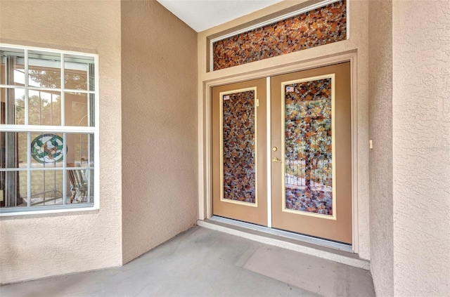 doorway to property with stucco siding