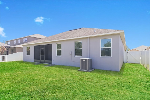 20067 Oakflower Ave, Tampa, FL 33647 - rear view of property with central air condition unit, stucco siding, a sunroom, roof with shingles, and a gate