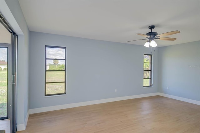 27050 Pelotas Dr, Punta Gorda, FL 33983 - unfurnished room with light wood finished floors, healthy amount of natural light, and baseboards