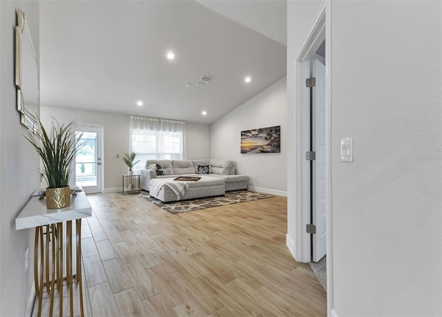 7664 Meroni Blvd, North Port, FL 34291 - bedroom featuring baseboards, light wood-type flooring, vaulted ceiling, and recessed lighting