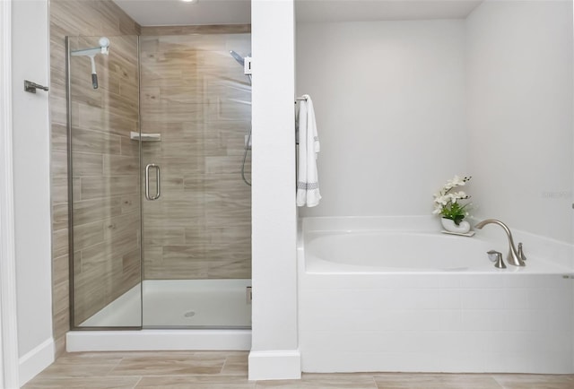 7664 Meroni Blvd, North Port, FL 34291 - full bathroom with a shower stall and a bath