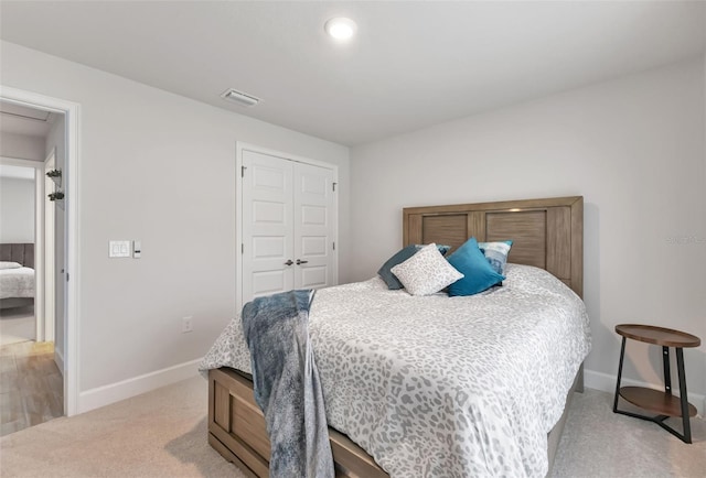 7664 Meroni Blvd, North Port, FL 34291 - bedroom featuring baseboards, light colored carpet, and a closet