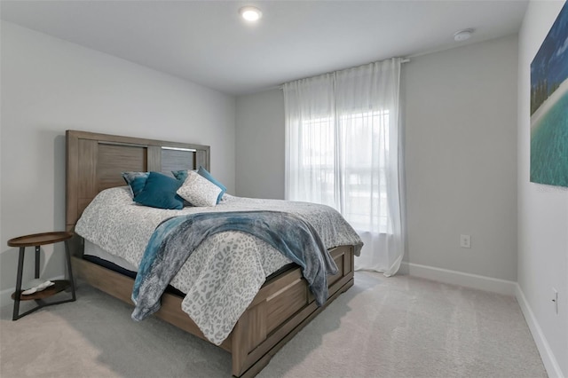 7664 Meroni Blvd, North Port, FL 34291 - bedroom with baseboards and light colored carpet