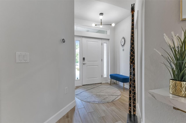 7664 Meroni Blvd, North Port, FL 34291 - entrance foyer featuring wood finished floors and baseboards