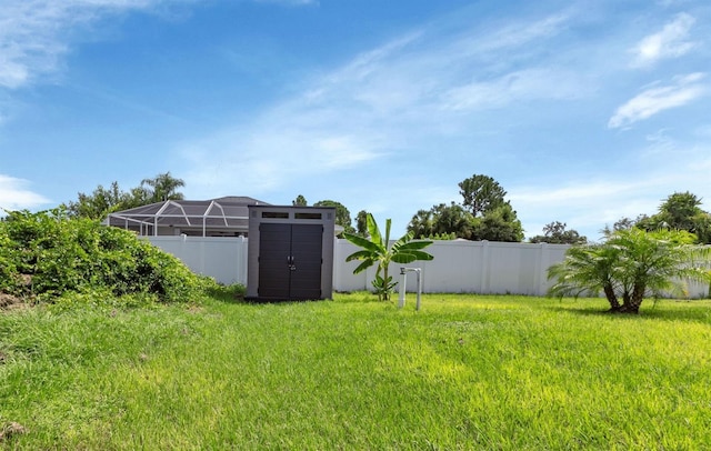 7664 Meroni Blvd, North Port, FL 34291 - fenced backyard featuring a storage shed and an outdoor structure