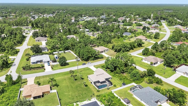 7664 Meroni Blvd, North Port, FL 34291 - aerial view of residential area with a heavily wooded area