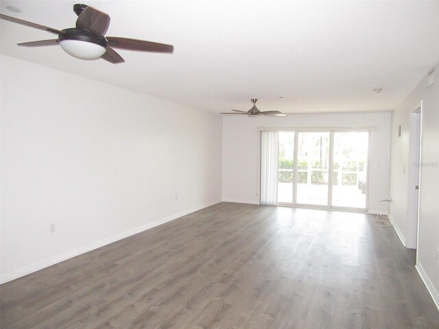 150 Harborside Ave Unit 124, Punta Gorda, FL 33950 - empty room with ceiling fan, wood finished floors, and baseboards